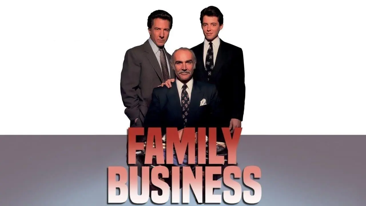 مembros of a family meeting around a table discussing business plans